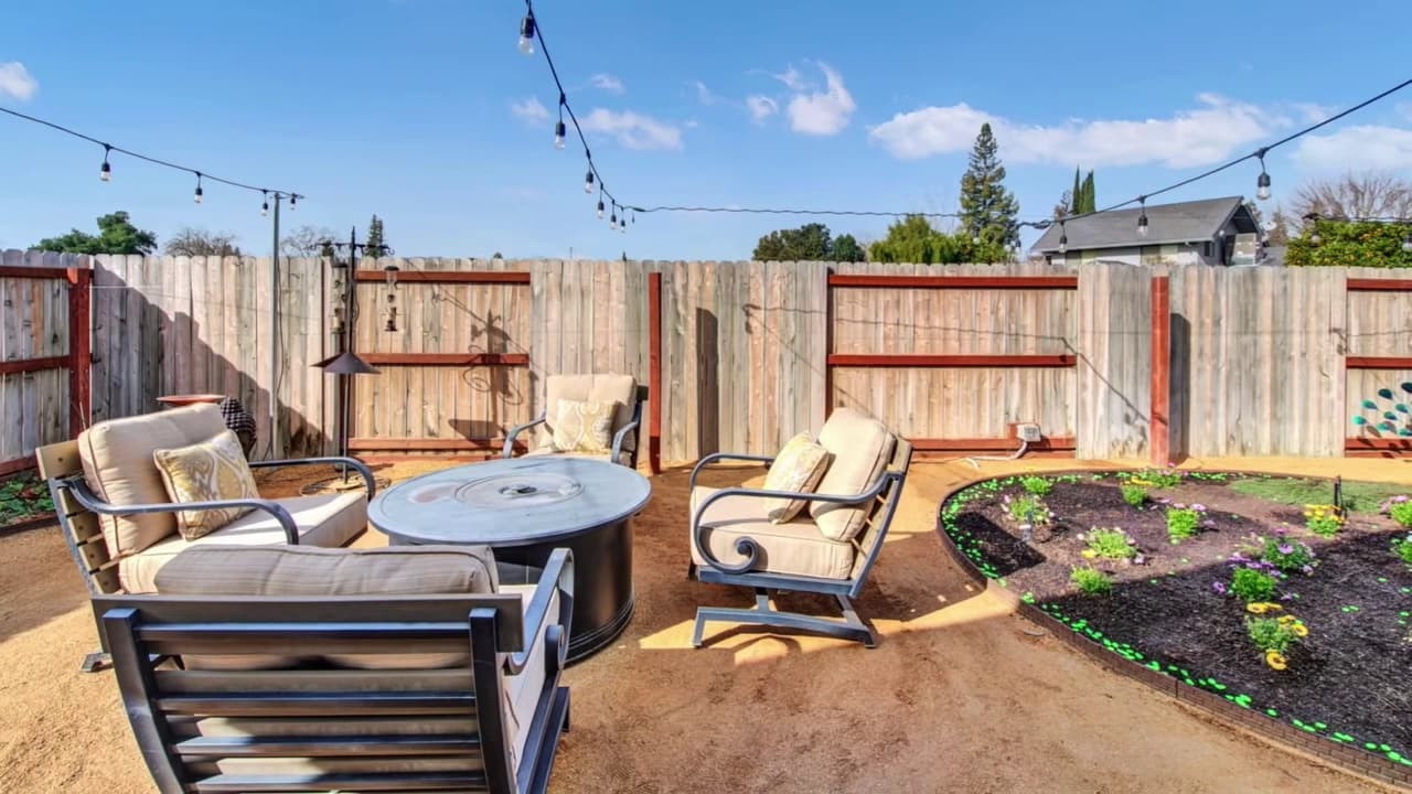 Outdoor seating area with garden beds in Sacramento backyard — Keystone Building Services