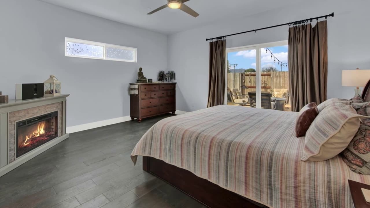 Master bedroom remodel with fireplace and patio doors in Sacramento — Keystone Building Services