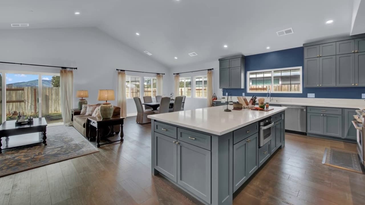 Kitchen island with open floor plan into living room in Sacramento — Keystone Building Services